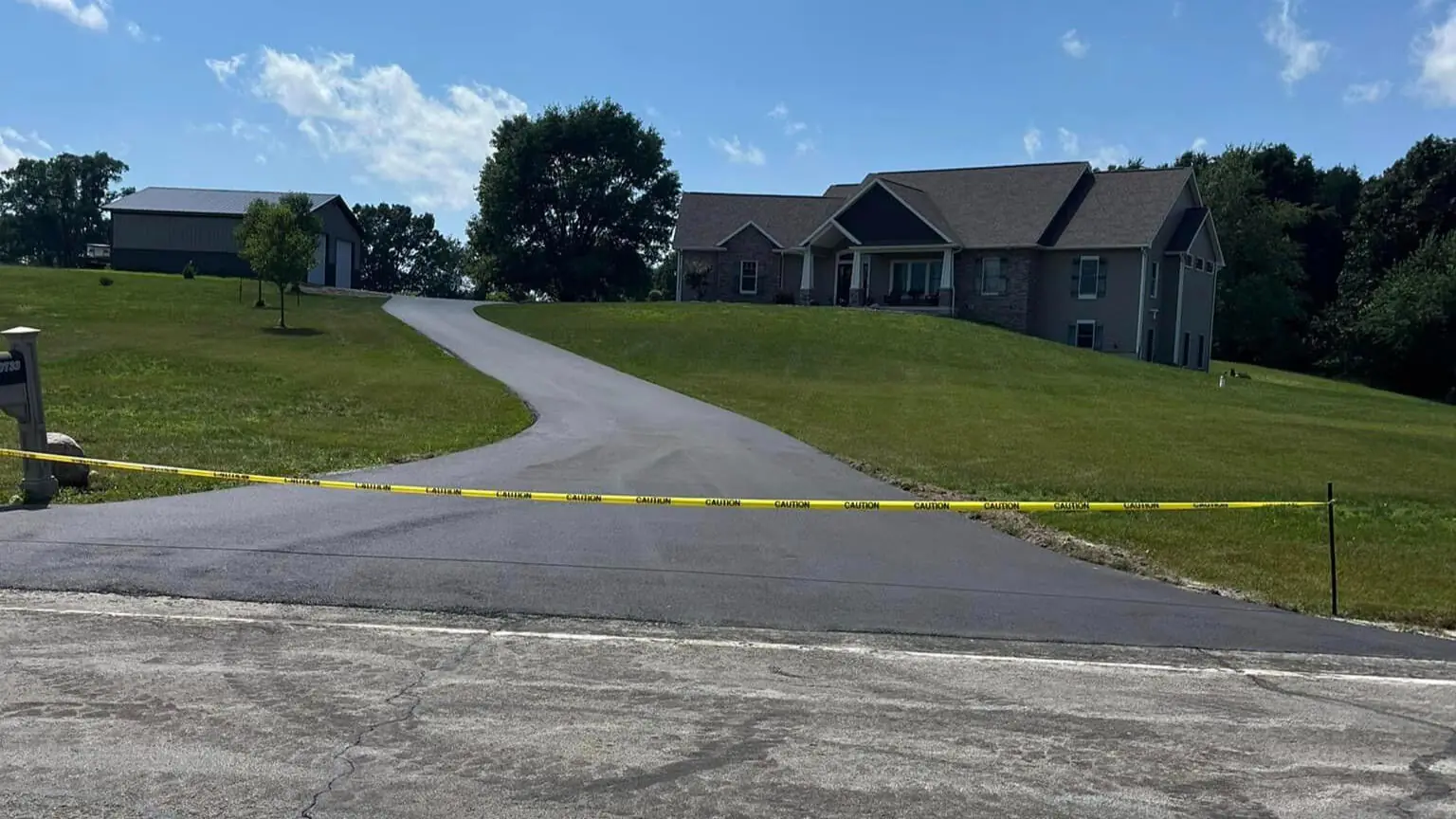 Finished asphalt driveway running up to a home in Lancaster County